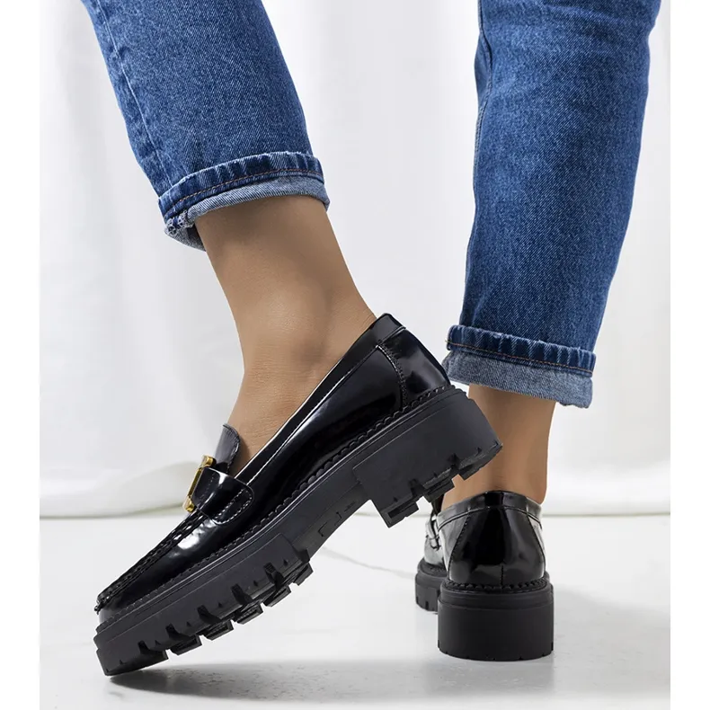 Black moccasins with elevated Dorland sole