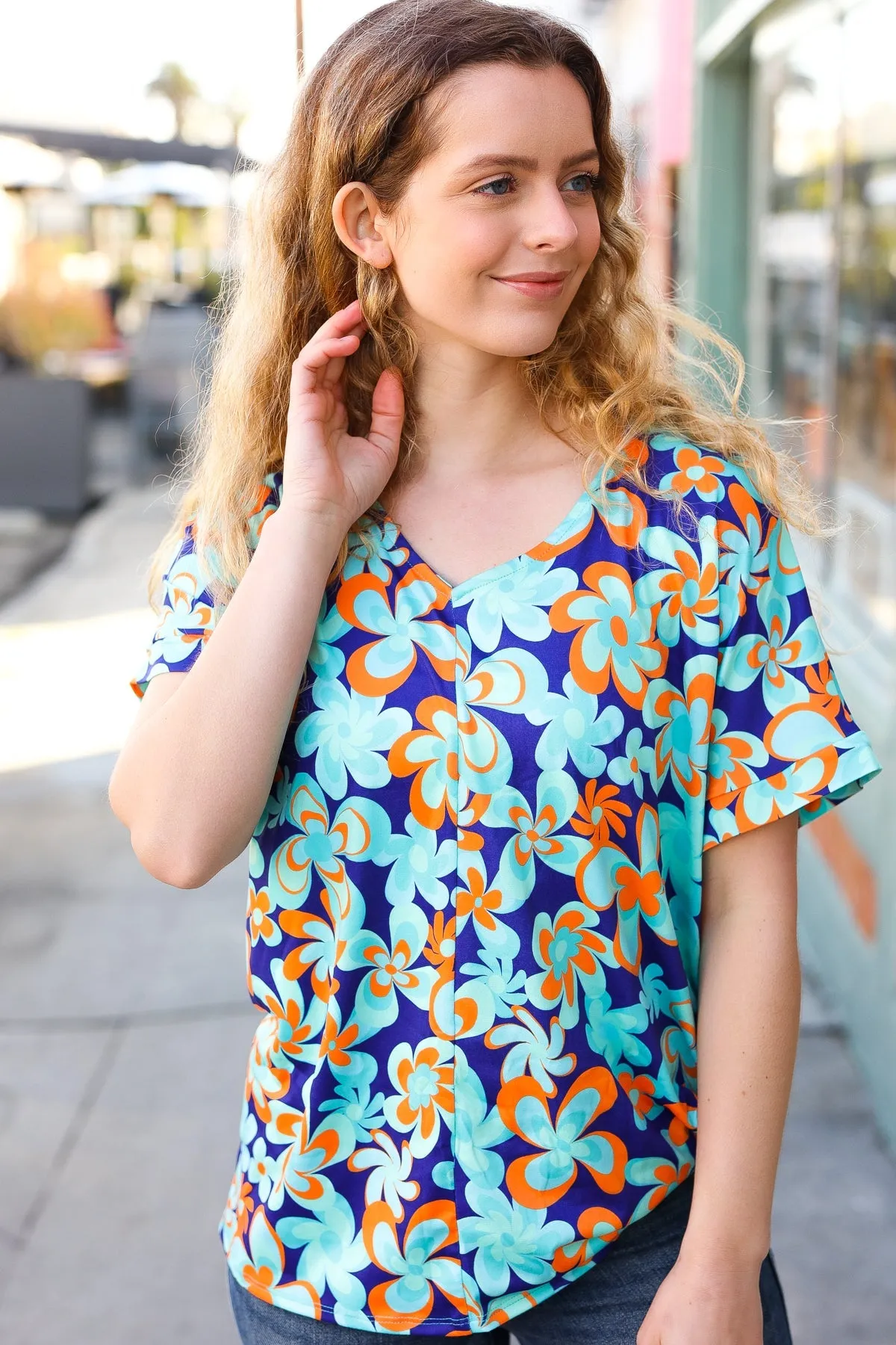 V Neck Top with Blue and Orange Flat Floral Design