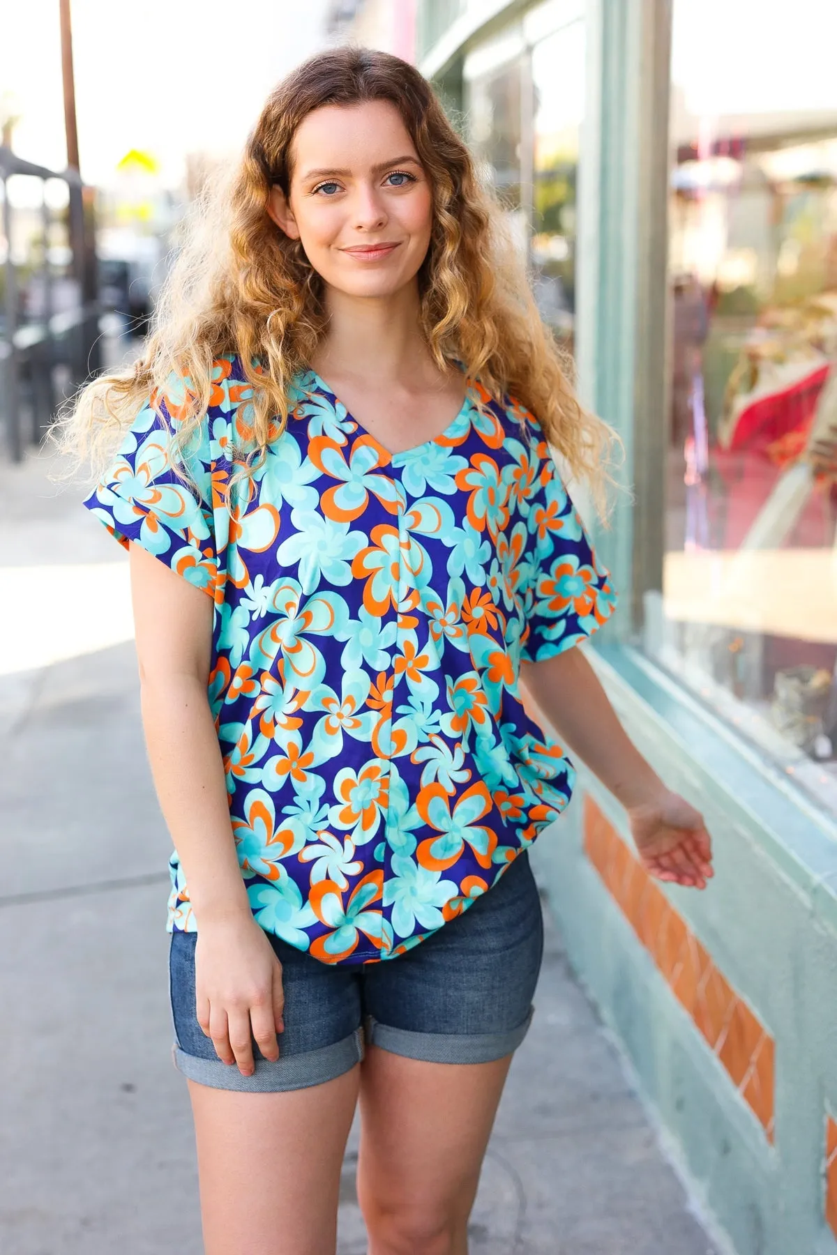 V Neck Top with Blue and Orange Flat Floral Design